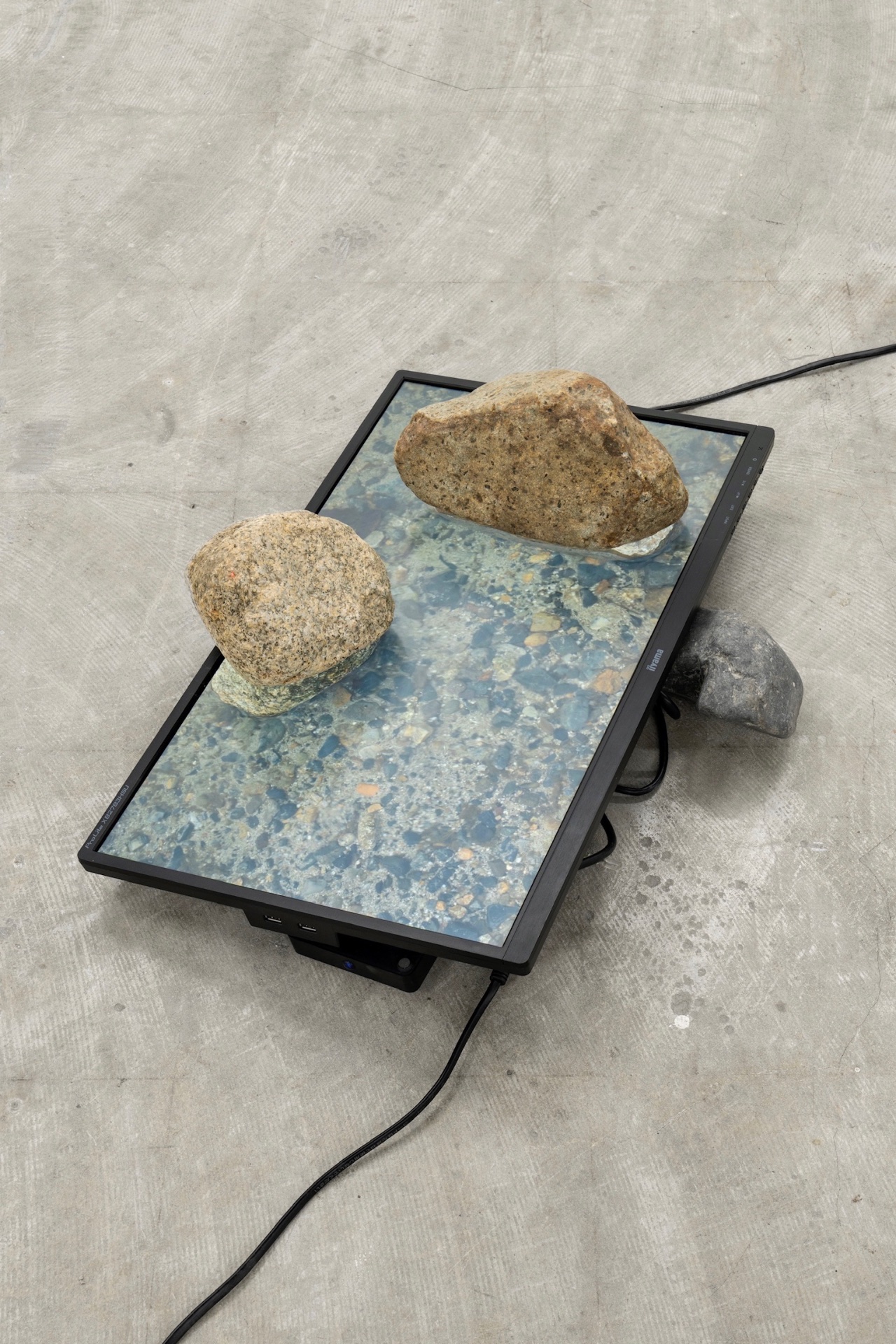 Out of office . Solo Exhibition — 2022 — Stones collected from rivers, displayed on video of their original flow. — Tokyo — by Sander Wassink — photo Go Itami